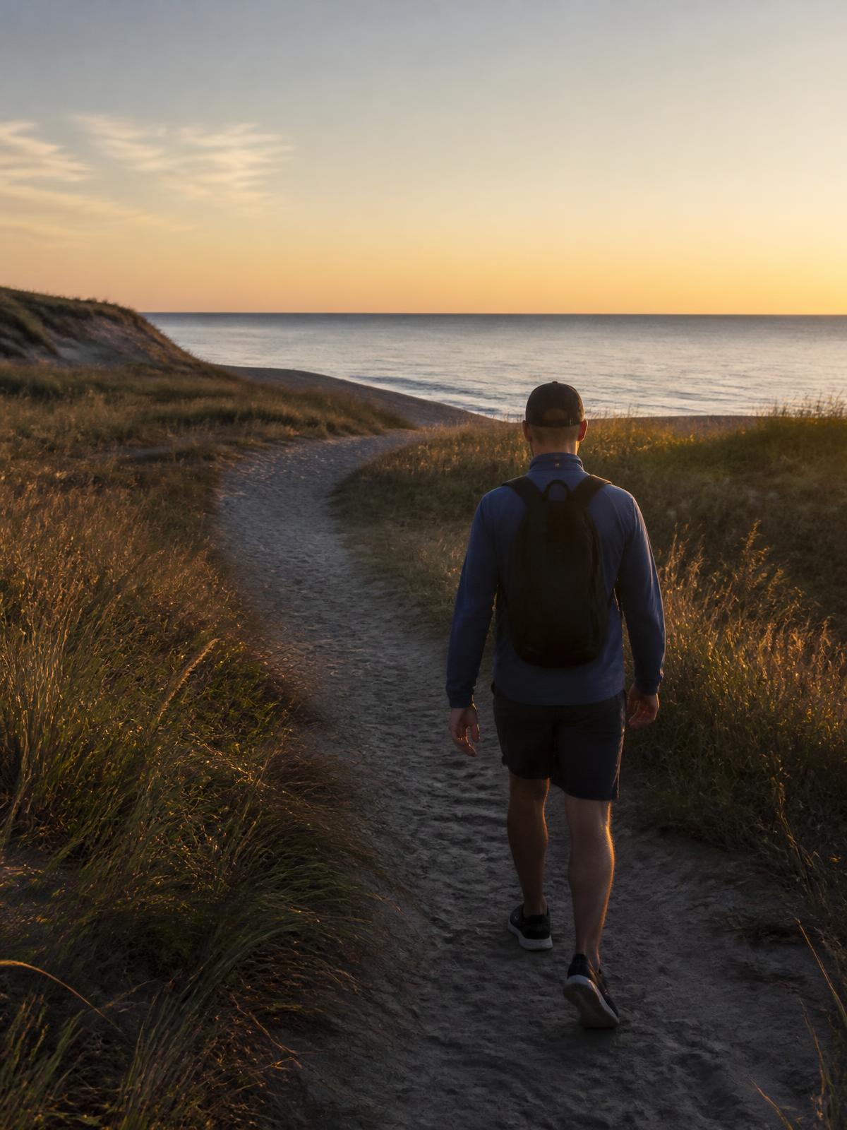 Denis walking a coastal trail on Emerald Isle, NC